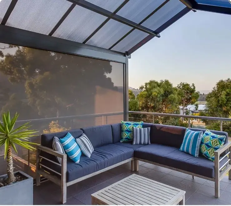 Outdoor patio with blue cushioned seating area.